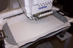 Embroidery hoop in the machine.
